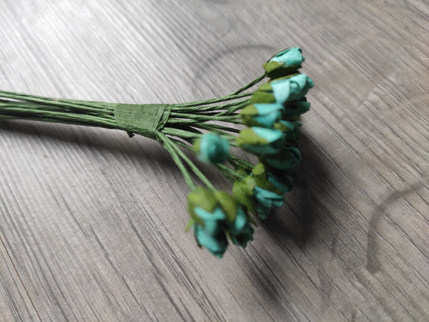 Set of tiny turquoise flowers