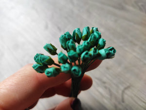 Set of tiny turquoise flowers